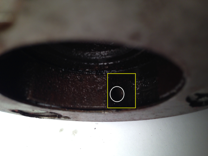 Recess in rotor with hole for spring and cap.  Does the roller follow the spring into that hole?