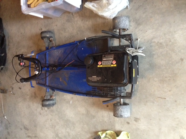 electric Razor drift kart with a 196cc engine bolted in the back.